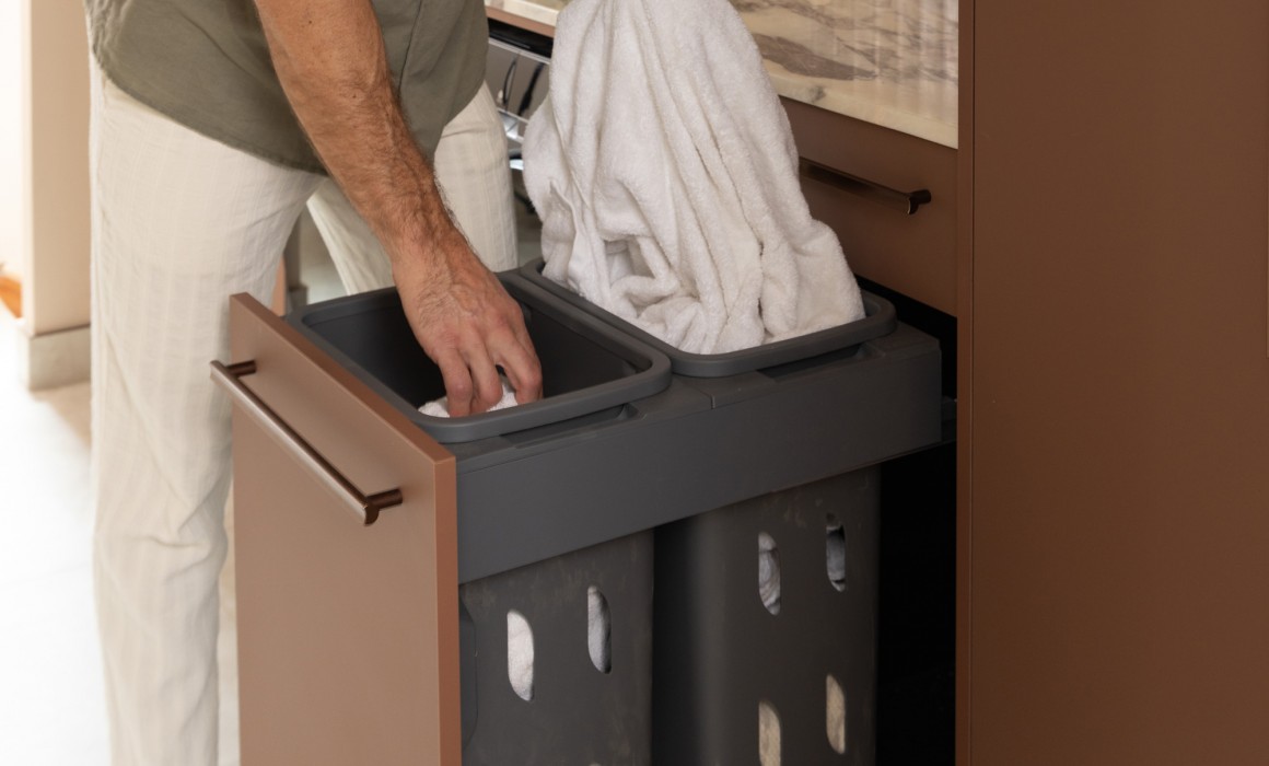 concealed laundry hampers behind cabinetry 7