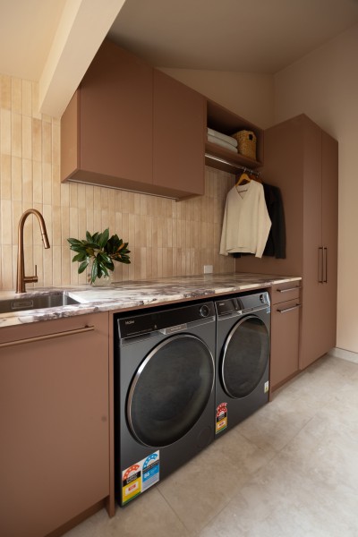 concealed laundry hampers behind cabinetry 1